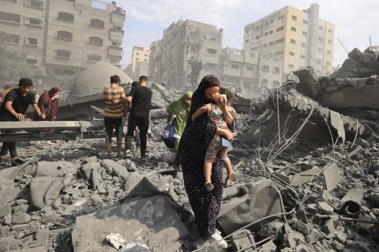 Israeli Strikes Kill 94 in Gaza as Humanitarian Aid Plans Begin
