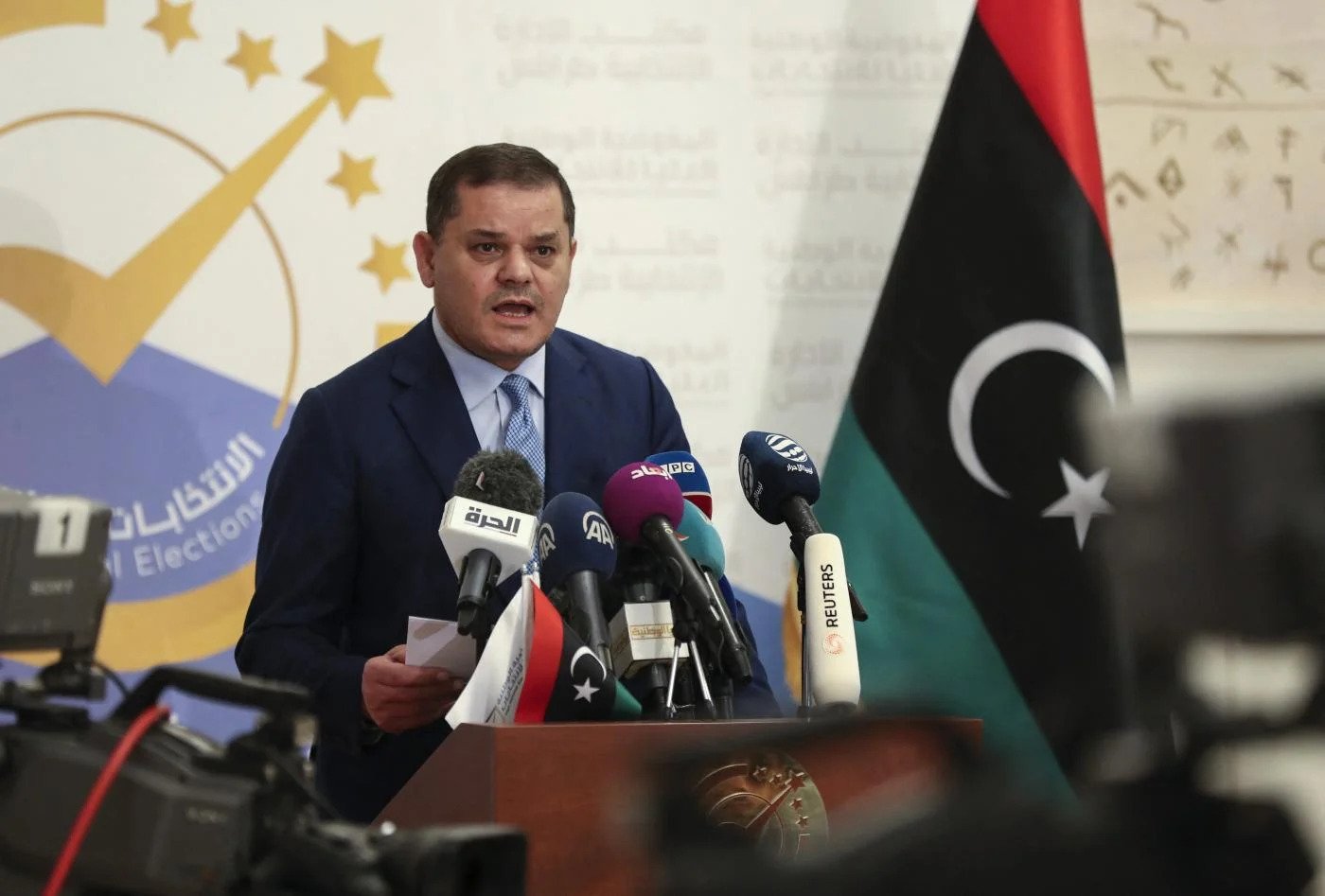 Libya's Premier Calls for Armed Groups to Align with State Institutions Amid Deadly Clashes and Protests