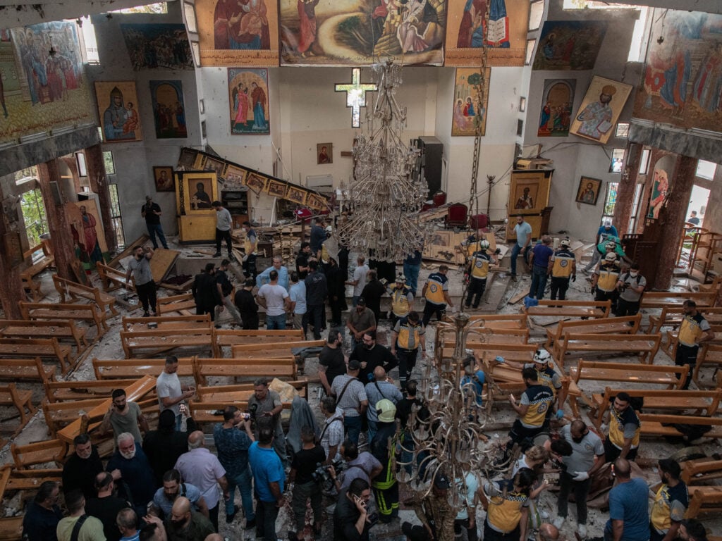 Shooting and suicide bombing at Damascus church kills at least 22 people