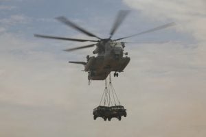US Marine Corps Completes Mid-Air Refuel with CH-53E Super Stallion Lifting Two Vehicles