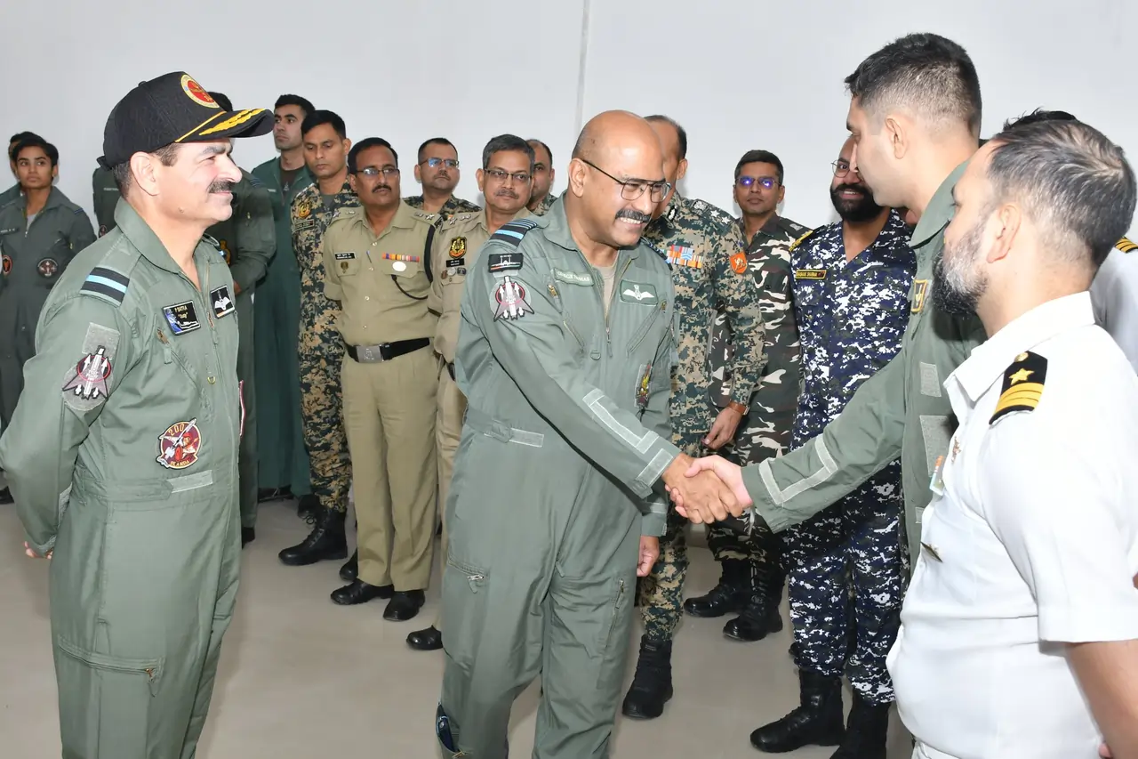 Air Marshal George Thomas Shaking Hands